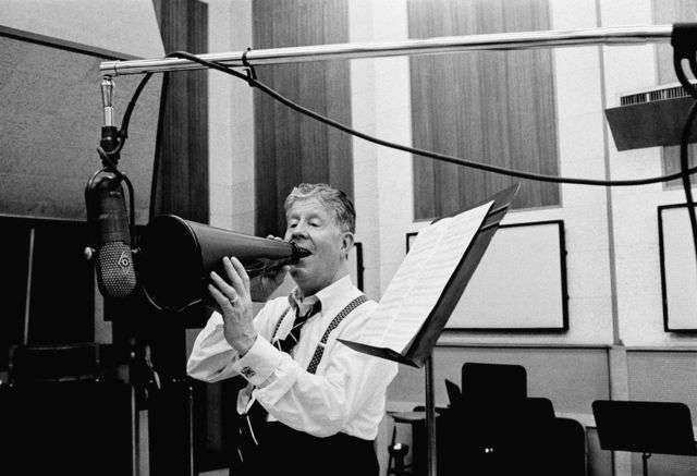Rudy Vallee reprises the old megaphone days.