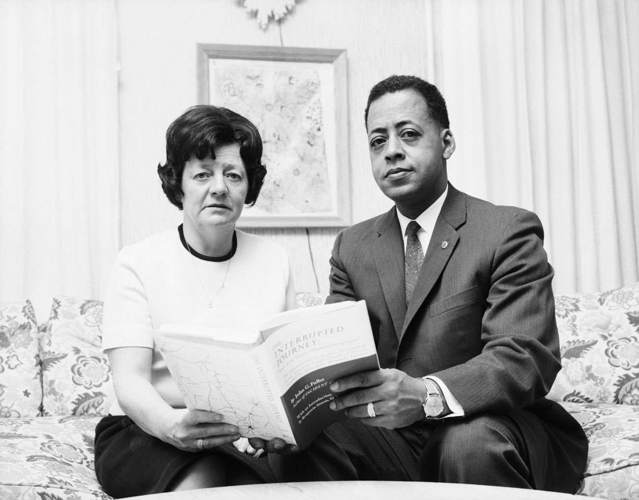 Betty and Barney Hill holding the 1966 book Interrupted Journey.