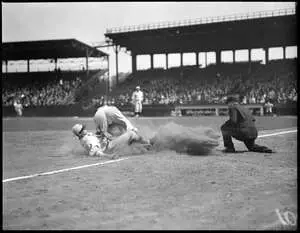 Unknown Detroit Tigers player slides into third base against unknown Boston Red Sox third baseman as ball pops loose in front of unknown umpire during a 1929 game at Fenway Park. The Red Sox probably lost. Photo courtesy Boston Public Library, Leslie Jones Collection.