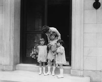 Grace Coolidge gets a May basket. Photo courtesy Library of Congress. 