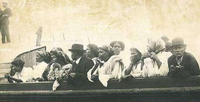 In 1914, immigrants from Brava, Cape Verde, looking ashore from the Savoia as the await the disembarkation process to be finished. Photo courtesy New Bedford Standard-Times.