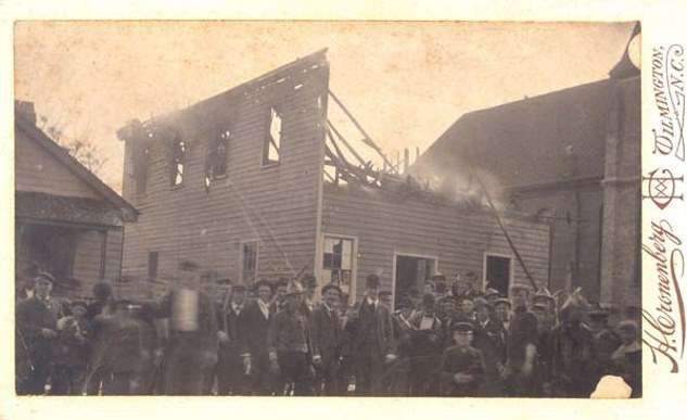 The destruction of the Daily Record building by Waddell’s Army during the Wilmington Riot of 1898.